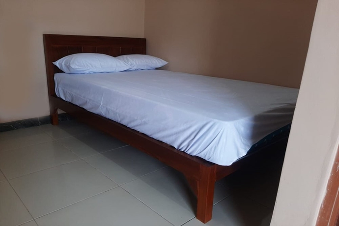 Imagen de la habitación del Hotel SPOT ON 93597 Syagita Kos and Penginapan Syariah. Foto 7