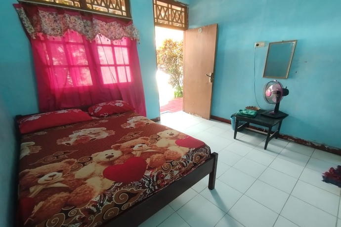 Imagen de la habitación del Hotel SPOT ON 93640 Dannis Homestay. Foto 2