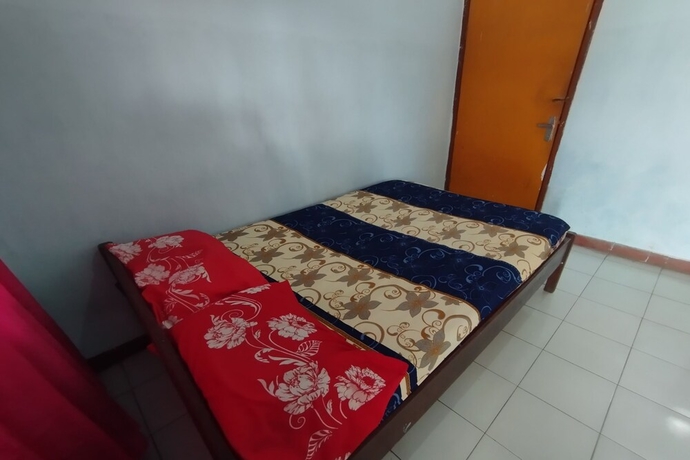 Imagen de la habitación del Hotel SPOT ON 93640 Dannis Homestay. Foto 3
