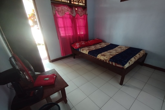 Imagen de la habitación del Hotel SPOT ON 93640 Dannis Homestay. Foto 5