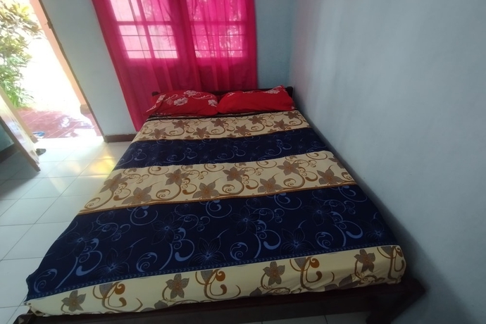 Imagen de la habitación del Hotel SPOT ON 93640 Dannis Homestay. Foto 9