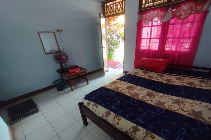 Imagen de la habitación del Hotel SPOT ON 93640 Dannis Homestay. Foto 10