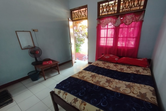Imagen de la habitación del Hotel SPOT ON 93640 Dannis Homestay. Foto 11