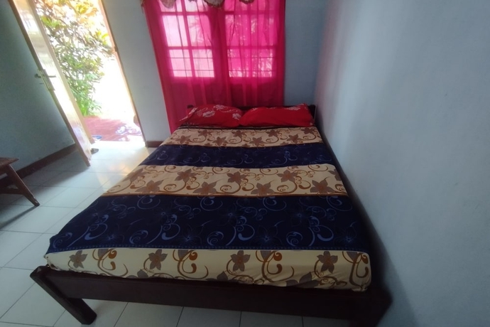 Imagen de la habitación del Hotel SPOT ON 93640 Dannis Homestay. Foto 13