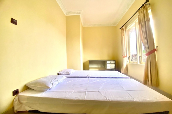 Imagen de la habitación del Hotel SPOT ON 93711 Kenzie Bunkbed Syariah. Foto 4