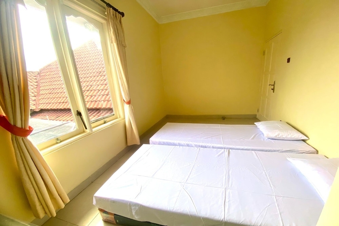 Imagen de la habitación del Hotel SPOT ON 93711 Kenzie Bunkbed Syariah. Foto 11