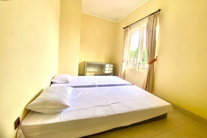 Imagen de la habitación del Hotel SPOT ON 93711 Kenzie Bunkbed Syariah. Foto 14