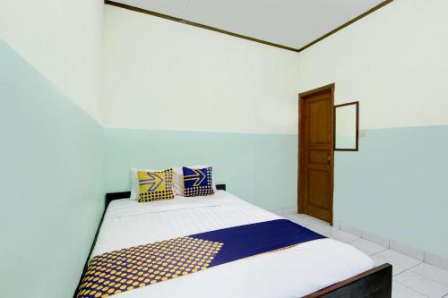 Imagen de la habitación del Hotel SPOT ON 94211 Pondok Wisata Kaliandra Kaliurang. Foto 19