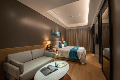 Imagen de la habitación del Hotel SSAW Boutique Wenzhou Dexin. Foto 14