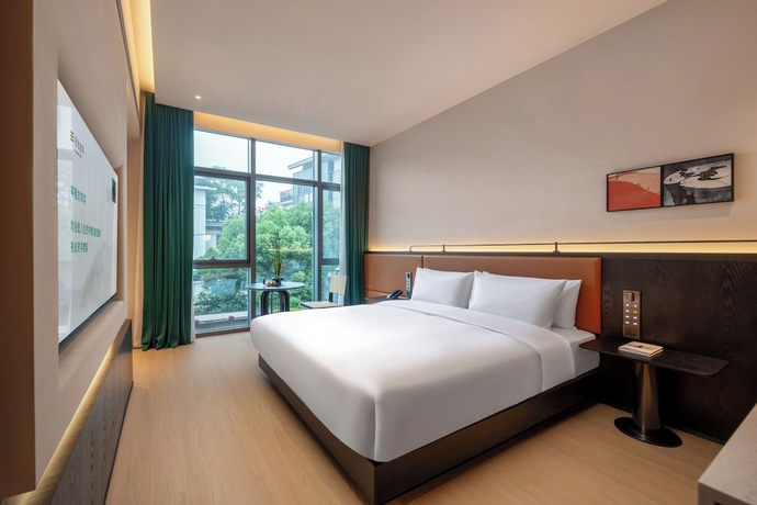 Imagen de la habitación del Hotel SSAW Garden Suzhou. Foto 6