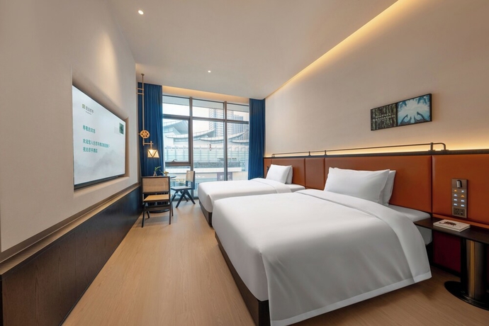 Imagen de la habitación del Hotel SSAW Garden Suzhou. Foto 13