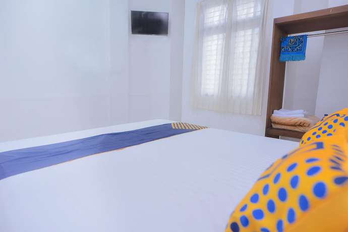 Imagen de la habitación del Hotel SUPER OYO 2134 Seunia. Foto 3