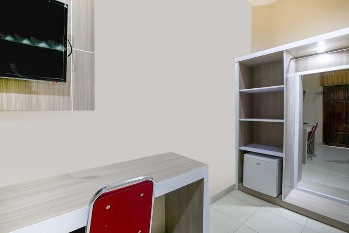 Imagen de la habitación del Hotel SUPER OYO 2320 Charvita. Foto 5