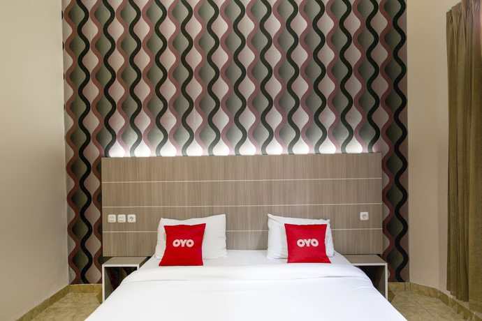 Imagen de la habitación del Hotel SUPER OYO 2320 Charvita. Foto 10