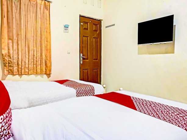 Imagen de la habitación del Hotel SUPER OYO 90689 Lily House. Foto 2