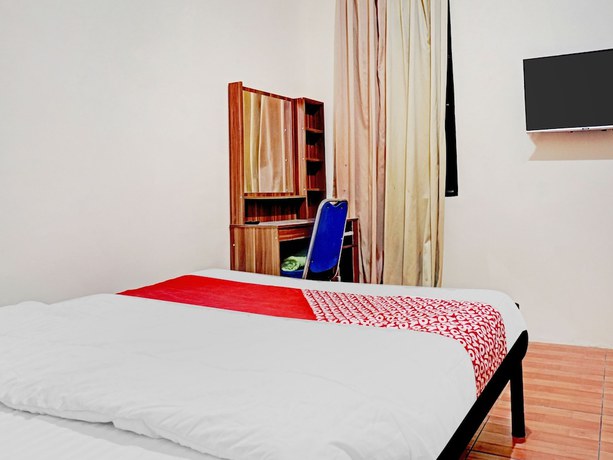 Imagen de la habitación del Hotel SUPER OYO 90689 Lily House. Foto 5