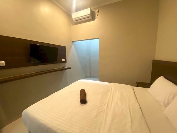 Imagen de la habitación del Hotel SUPER OYO 93287 Pioneer Pasar Baru. Foto 2