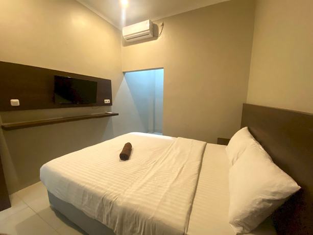 Imagen de la habitación del Hotel SUPER OYO 93287 Pioneer Pasar Baru. Foto 6