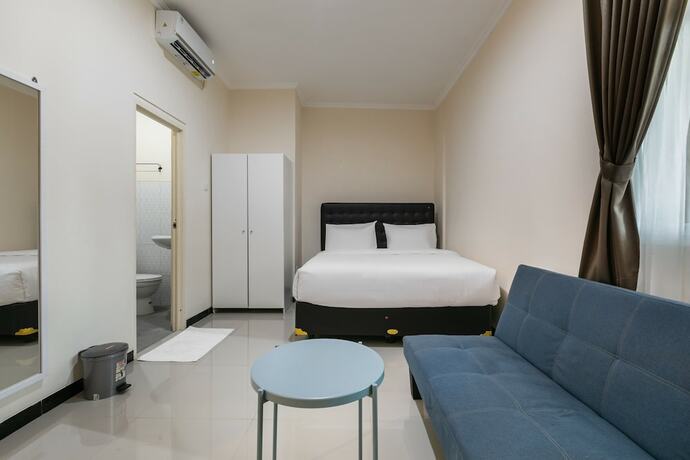 Imagen de la habitación del Hotel SUPER OYO Capital O 3930 Griya Loka Syariah. Foto 15