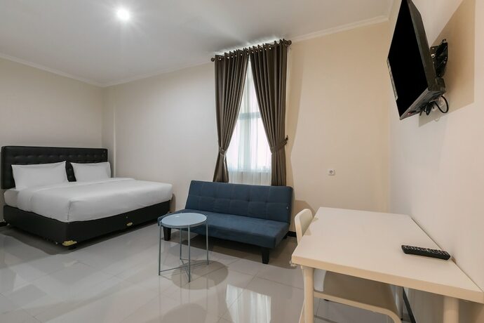 Imagen de la habitación del Hotel SUPER OYO Capital O 3930 Griya Loka Syariah. Foto 18