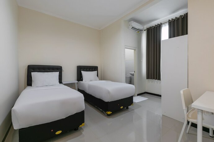 Imagen de la habitación del Hotel SUPER OYO Capital O 3930 Griya Loka Syariah. Foto 20