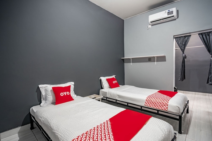 Imagen de la habitación del Hotel SUPER OYO Gandaria Guest House Near Masjid Raya Sumatera Barat. Foto 4