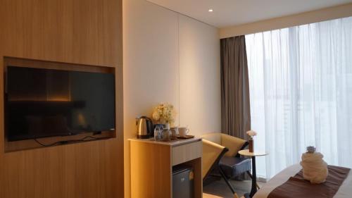 Imagen de la habitación del Hotel SZ Canalside. Foto 19