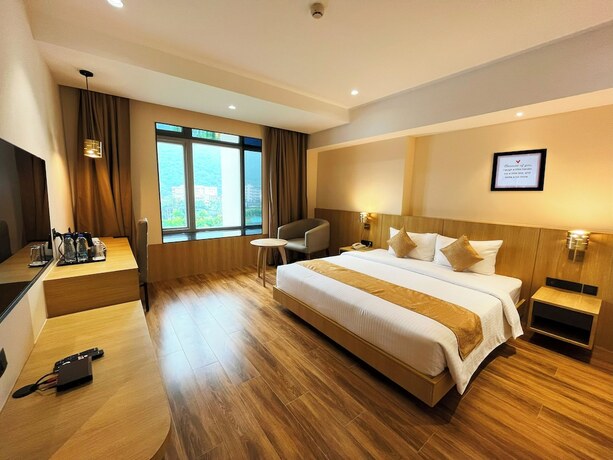 Imagen de la habitación del Hotel Sachikas, Guwahati. Foto 17
