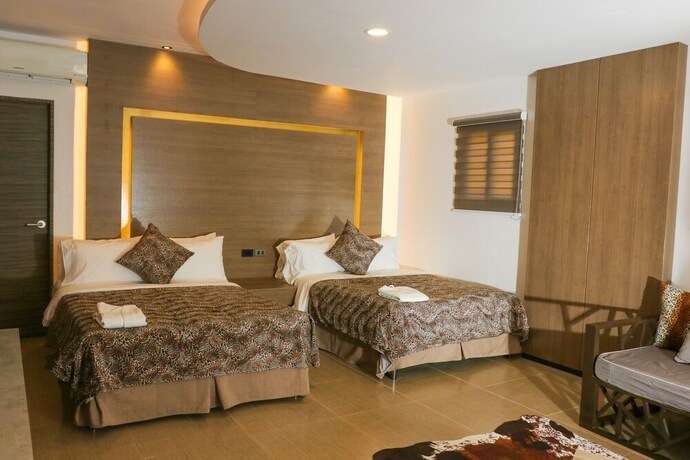 Imagen de la habitación del Hotel Safari Hotel And Villas. Foto 17