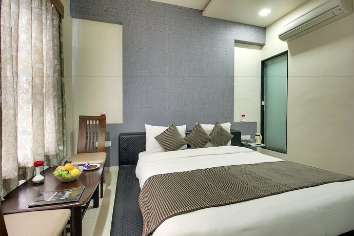 Imagen de la habitación del Hotel Sai Miracle. Foto 21