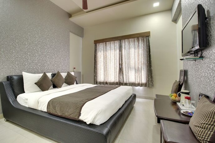 Imagen de la habitación del Hotel Sai Miracle. Foto 27