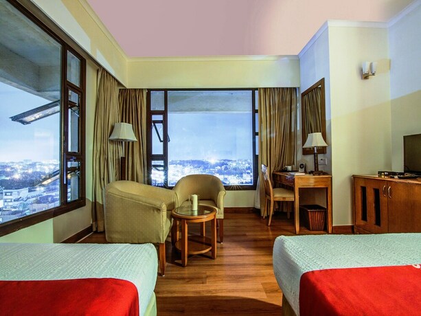 Imagen de la habitación del Hotel Sai Vishram Business. Foto 24