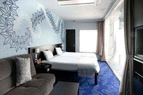 Imagen de la habitación del Hotel Sakishima Cosmo Tower. Foto 8