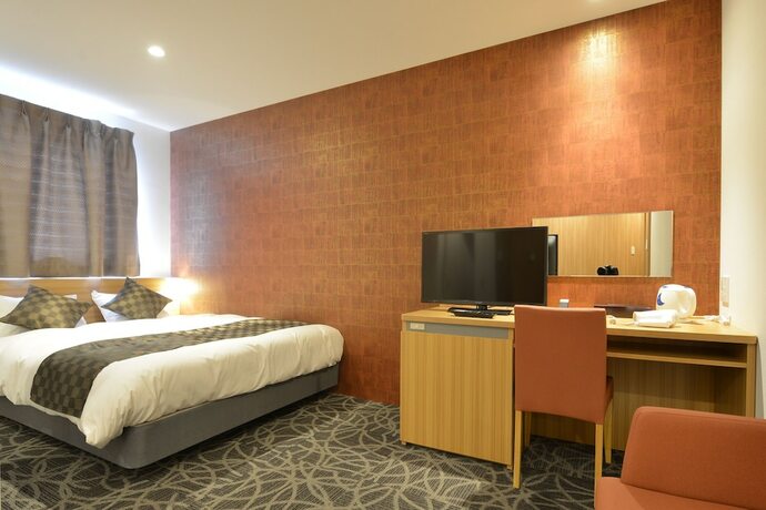 Imagen de la habitación del Hotel Sakura Garden. Foto 15