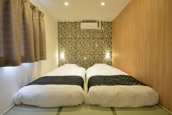 Imagen de la habitación del Hotel Sakura Garden. Foto 16