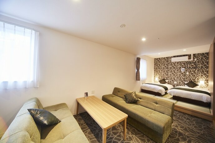 Imagen de la habitación del Hotel Sakura Garden. Foto 20