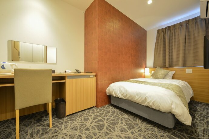 Imagen de la habitación del Hotel Sakura Garden. Foto 23