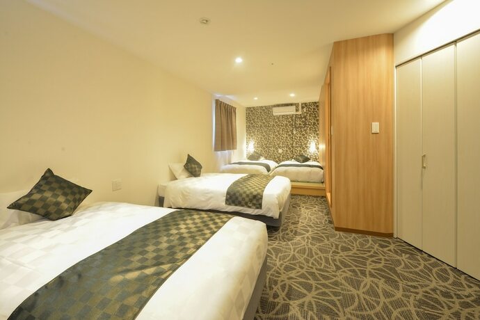 Imagen de la habitación del Hotel Sakura Garden. Foto 28