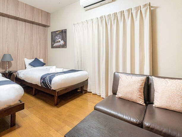 Imagen de la habitación del Hotel Sakura Sands Hotel. Foto 11
