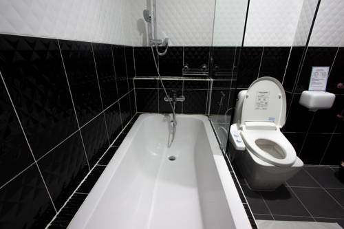 Imagen de la habitación del Hotel Sakura Sky Residence. Foto 16