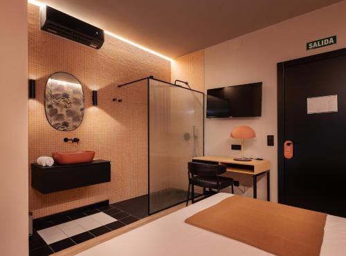 Imagen de la habitación del Hotel Saman Boutique. Foto 7