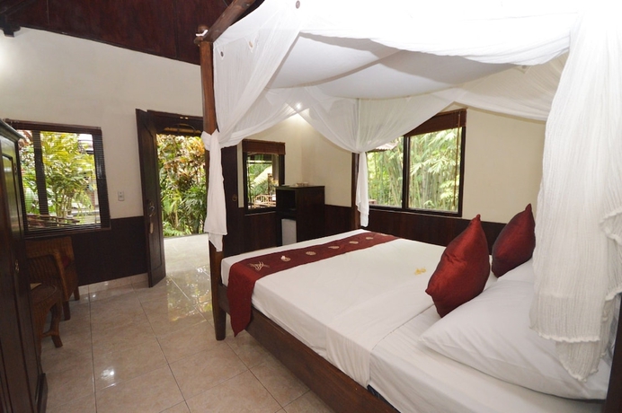 Imagen de la habitación del Hotel Sama's Cottages and Villas. Foto 2