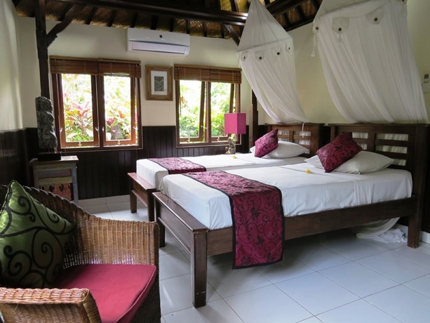 Imagen de la habitación del Hotel Sama's Cottages and Villas. Foto 11