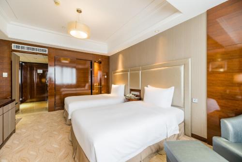 Imagen de la habitación del Hotel S&N Jiujiang. Foto 11