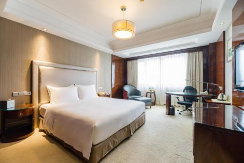 Imagen de la habitación del Hotel S&N Jiujiang. Foto 12
