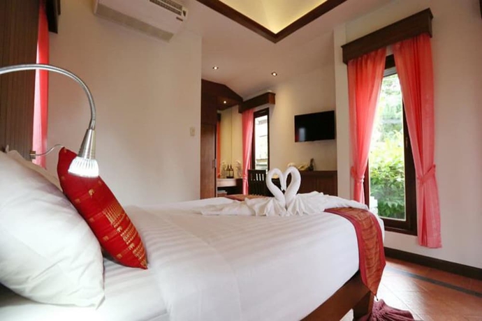 Imagen de la habitación del Hotel Samui Honey Cottages Beach Resort. Foto 13