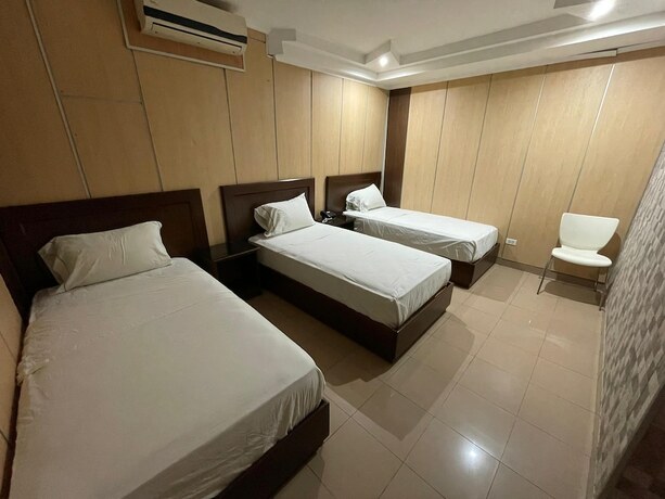 Imagen de la habitación del Hotel San Thomas Inn. Foto 8