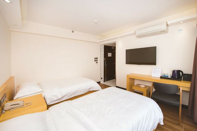 Imagen de la habitación del Hotel San Tung Fong Commercial Inn South Wing. Foto 22