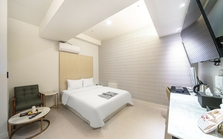Imagen de la habitación del Hotel Sanbon CF. Foto 16