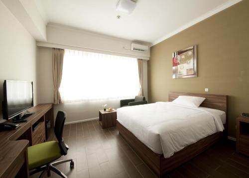 Imagen de la habitación del Hotel Sancrest Residence Deltamas. Foto 6